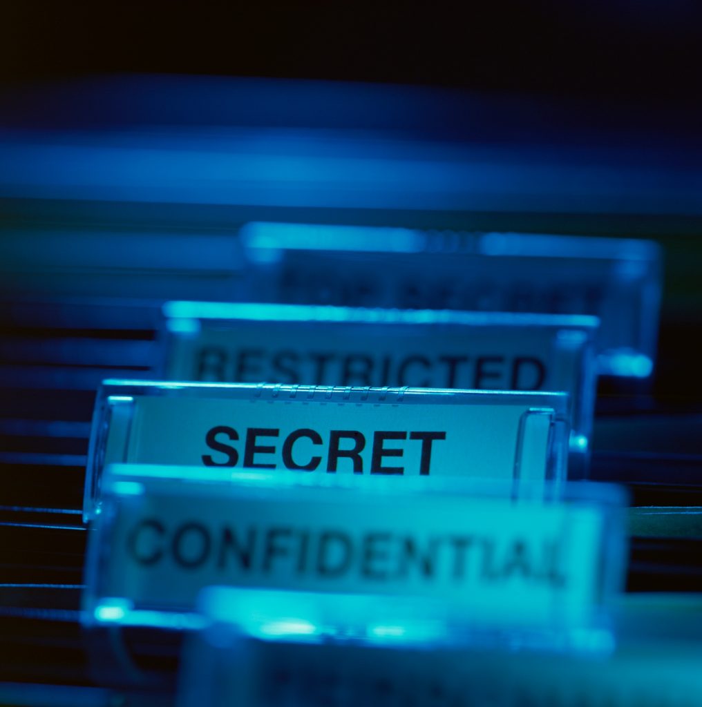 Labels in filing cabinet representing different levels of security